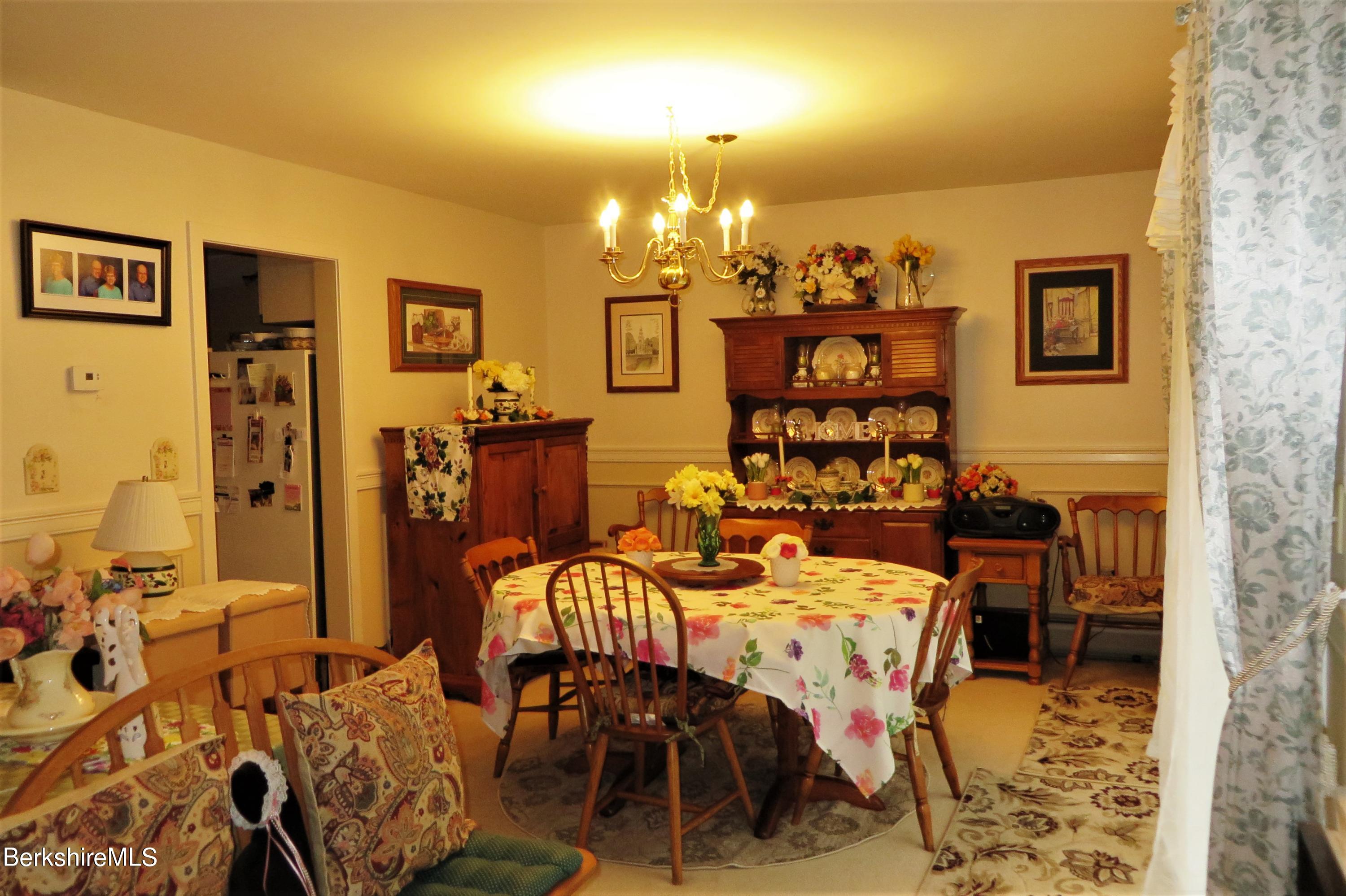 751 Mohawk Trail, Unit 1D North Adams, MA 01247 - Photo 18 of 32 a view of a dining room with furniture and chandelier