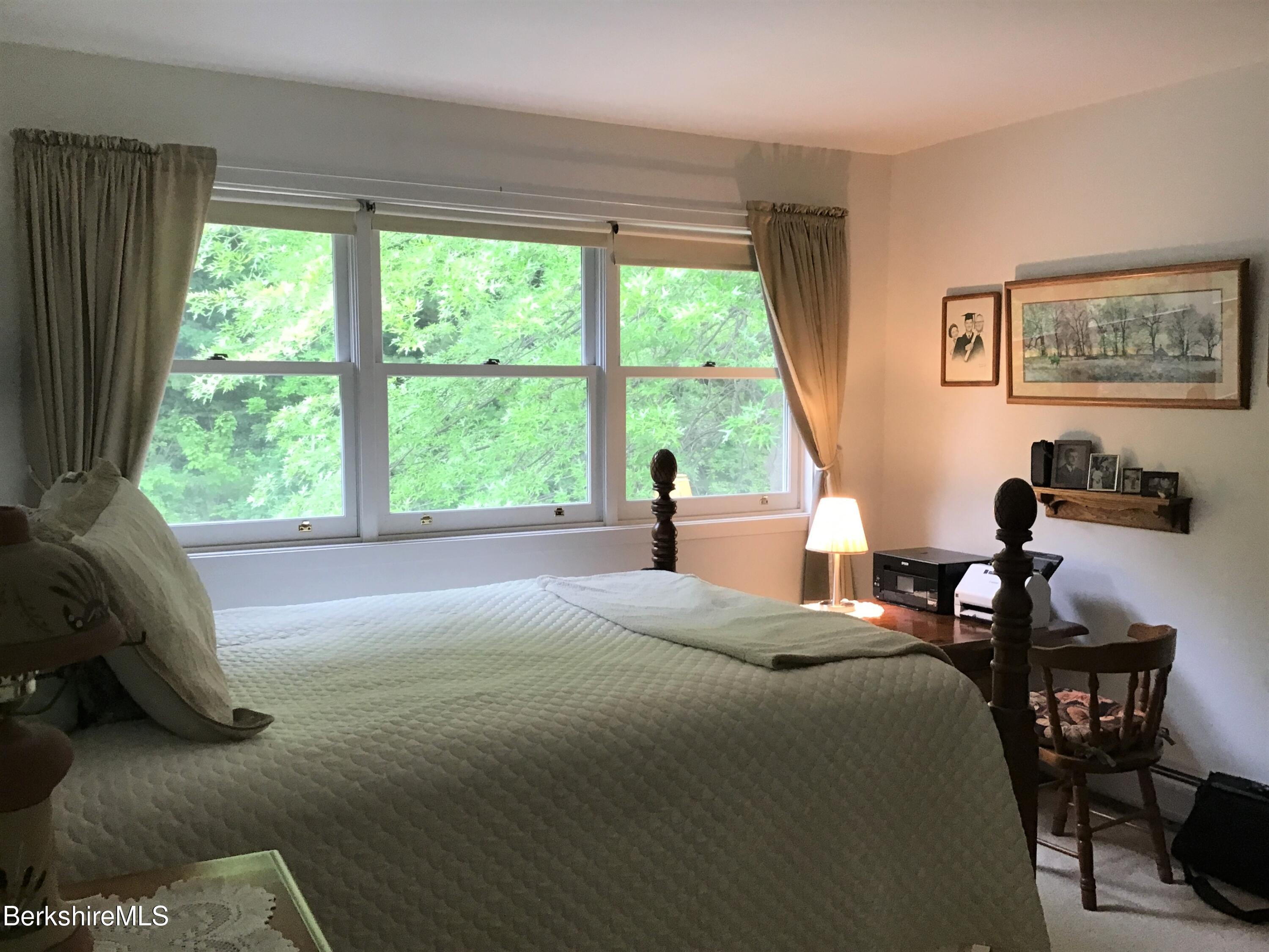 751 Mohawk Trail, Unit 1D North Adams, MA 01247 - Photo 20 of 32 a bedroom with a bed and a large window