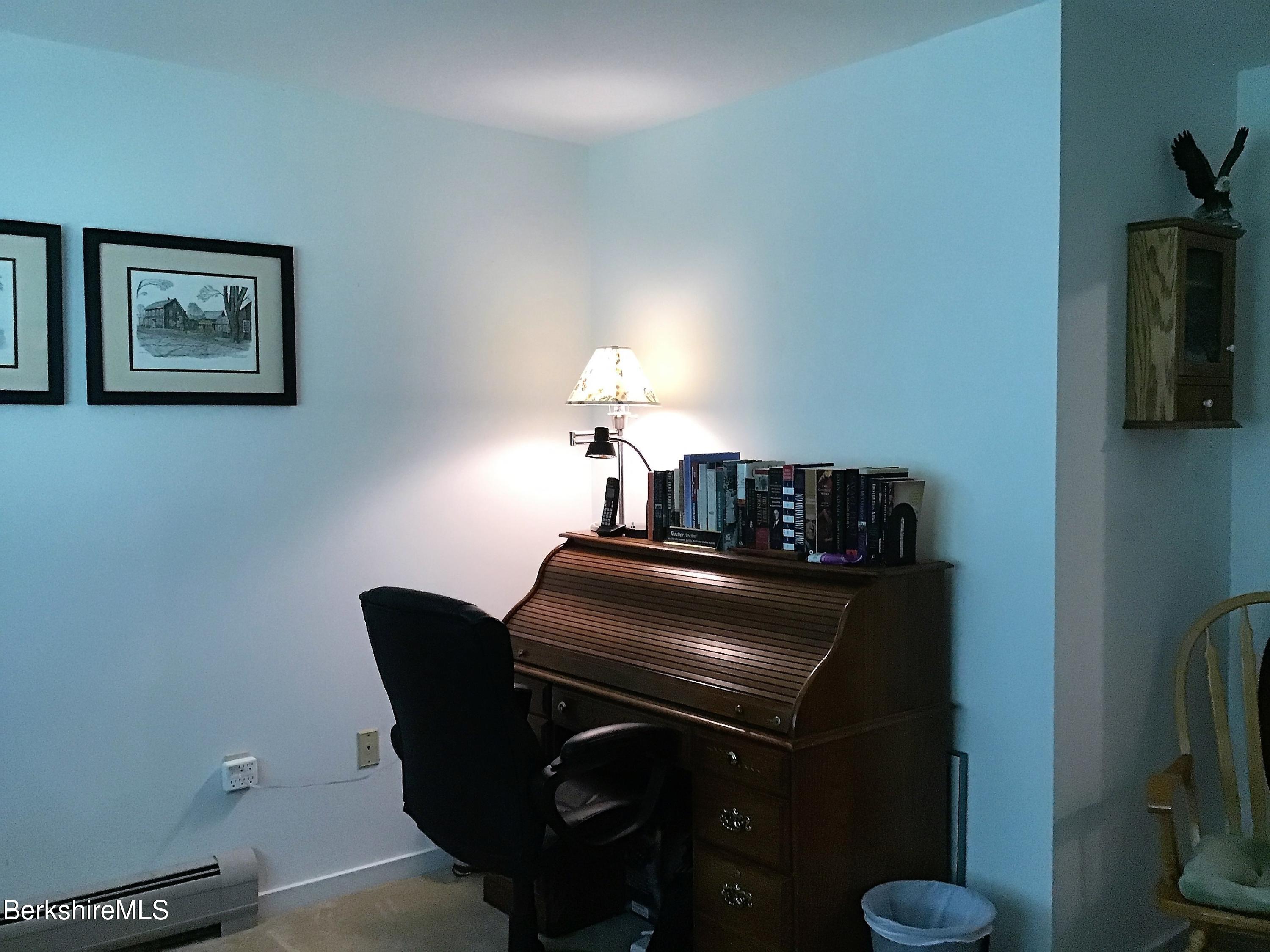 751 Mohawk Trail, Unit 1D North Adams, MA 01247 - Photo 26 of 32 a living room with furniture and a flat screen tv