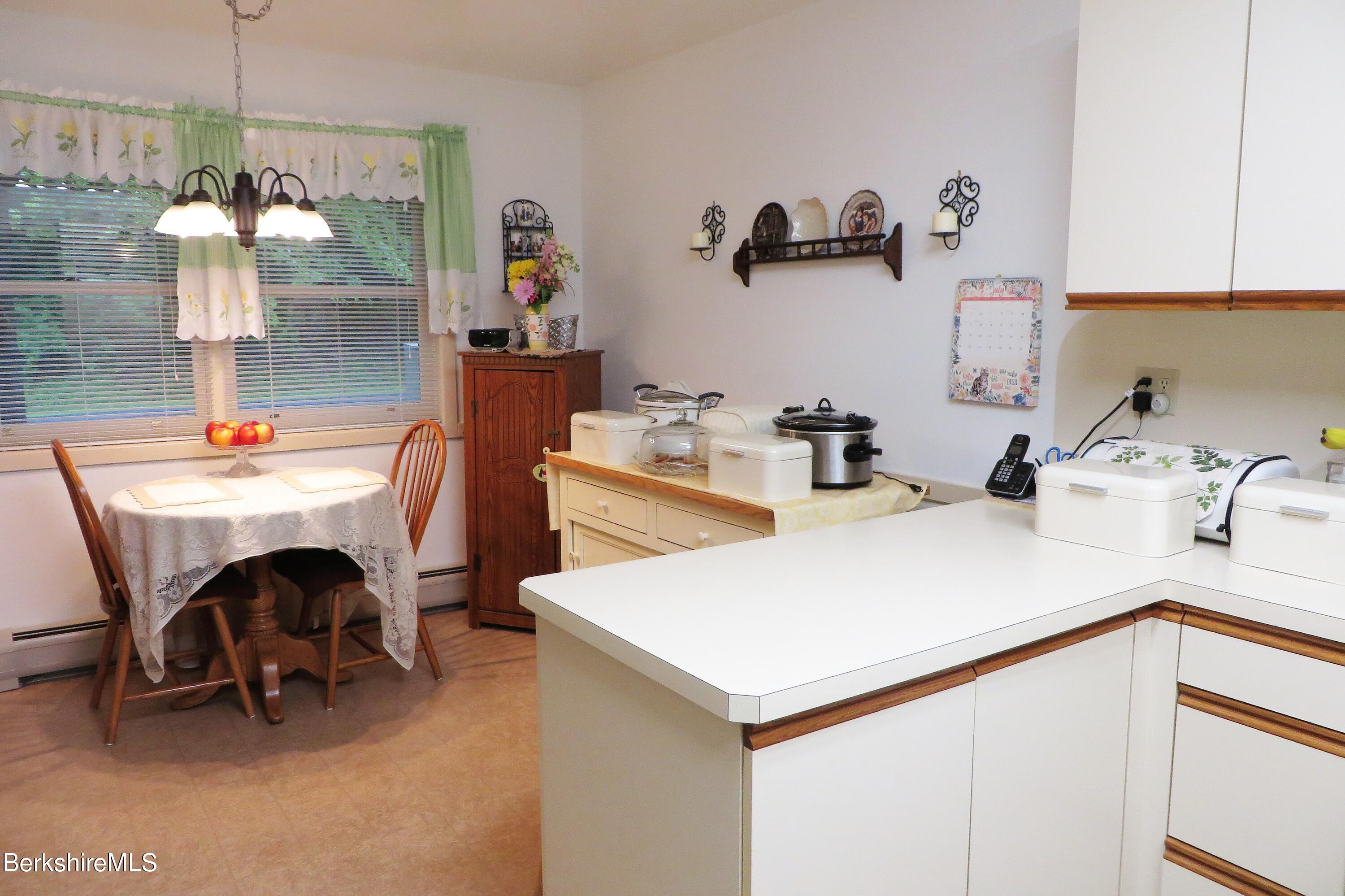 751 Mohawk Trail, Unit 1D North Adams, MA 01247 - Photo 5 of 32 a room with a table chairs and entryway