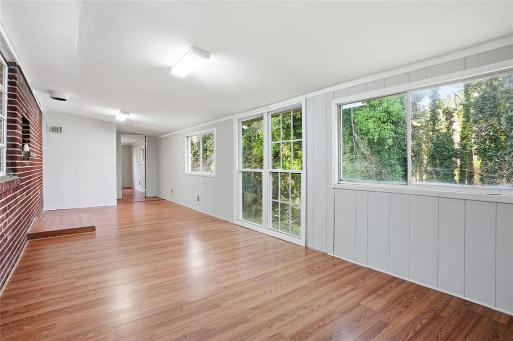 345 Brannan Road McDonough, GA 30253 - Photo 12 of 34 a view of an empty room with wooden floor and a window