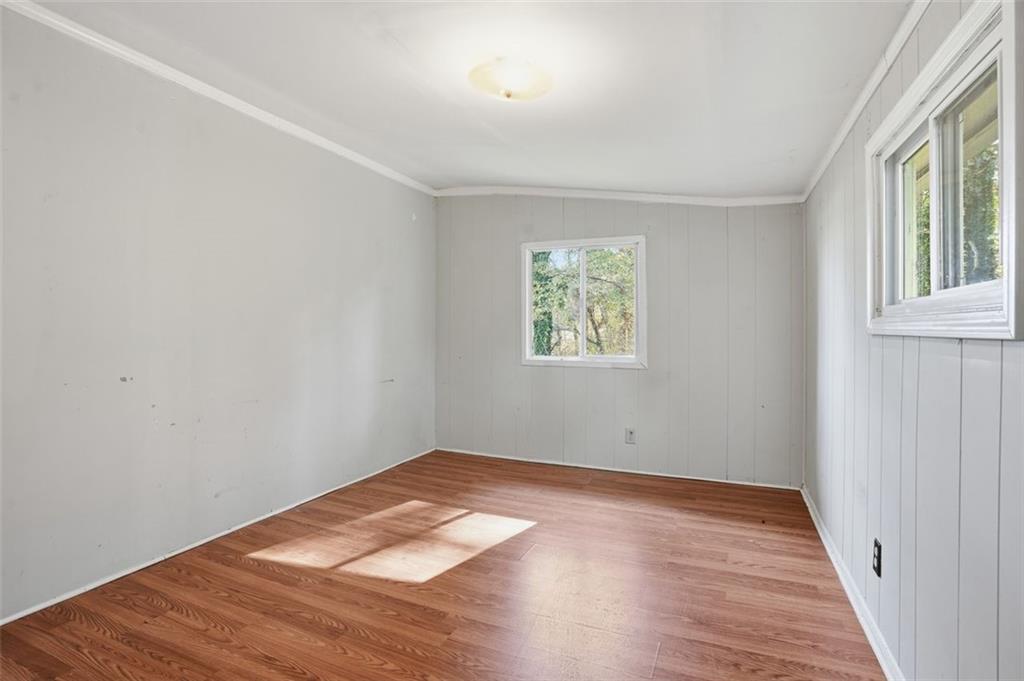 345 Brannan Road McDonough, GA 30253 - Photo 14 of 34 an empty room with wooden floor and windows