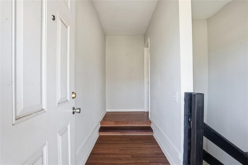345 Brannan Road McDonough, GA 30253 - Photo 15 of 34 a view of a hallway with wooden floor