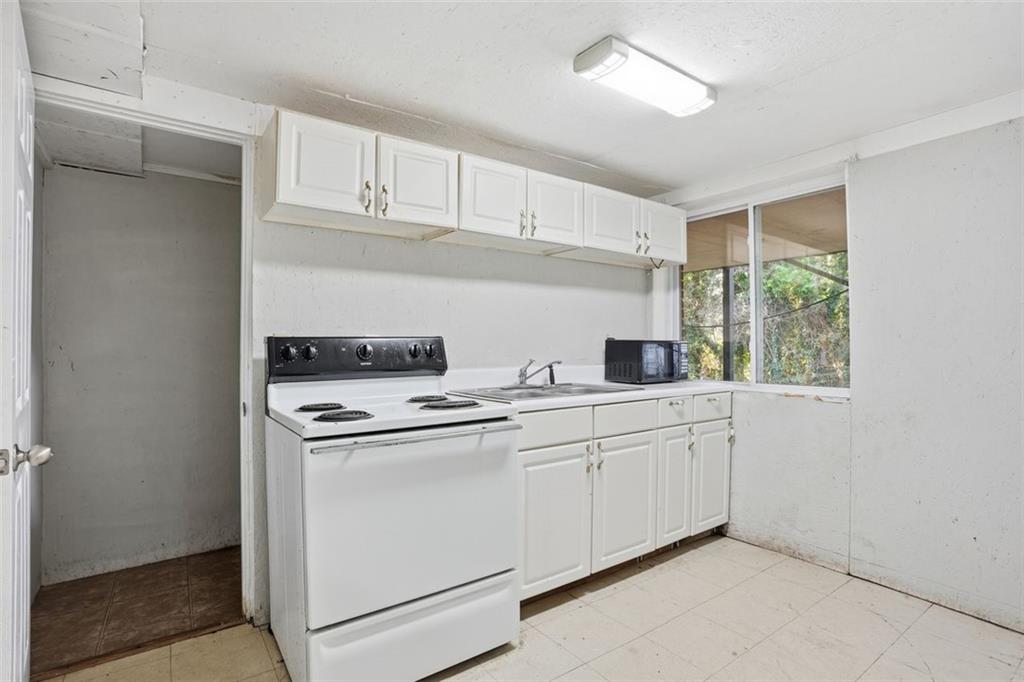 345 Brannan Road McDonough, GA 30253 - Photo 20 of 34 a kitchen with appliances cabinets and a sink