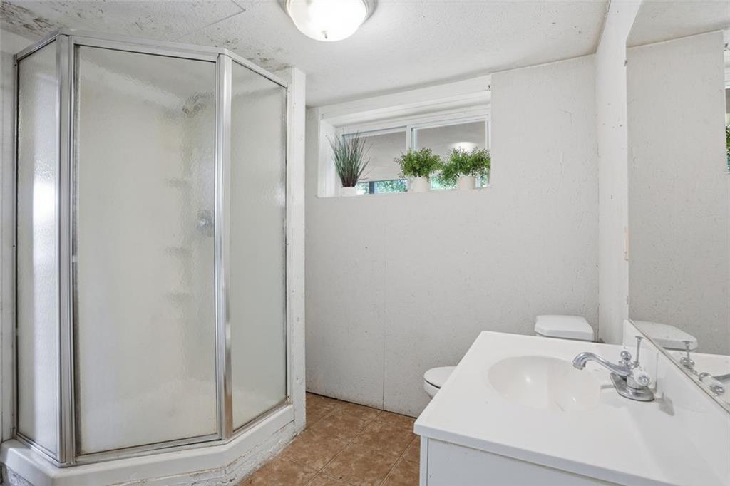 345 Brannan Road McDonough, GA 30253 - Photo 22 of 34 a bathroom with a sink and mirror