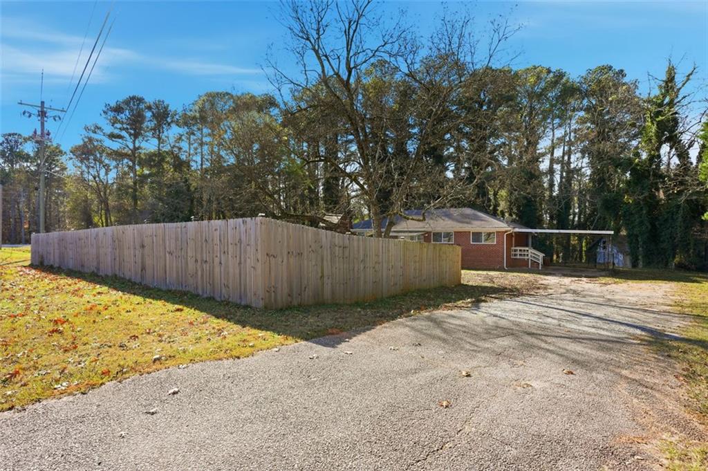 345 Brannan Road McDonough, GA 30253 - Photo 25 of 34 a view of wooden fence next to a yard