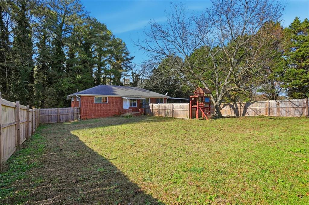 345 Brannan Road McDonough, GA 30253 - Photo 26 of 34 a front view of a house with garden
