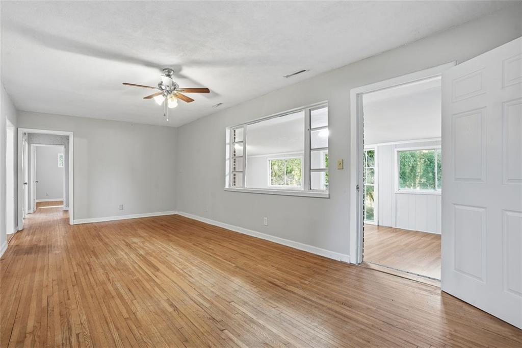 345 Brannan Road McDonough, GA 30253 - Photo 4 of 34 a view of empty room with wooden floor and fan