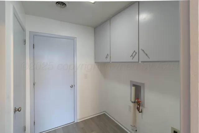 a kitchen with granite countertop a sink stove and cabinets