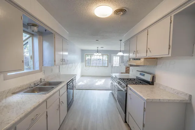a bathroom with a bathtub shower sink and toilet