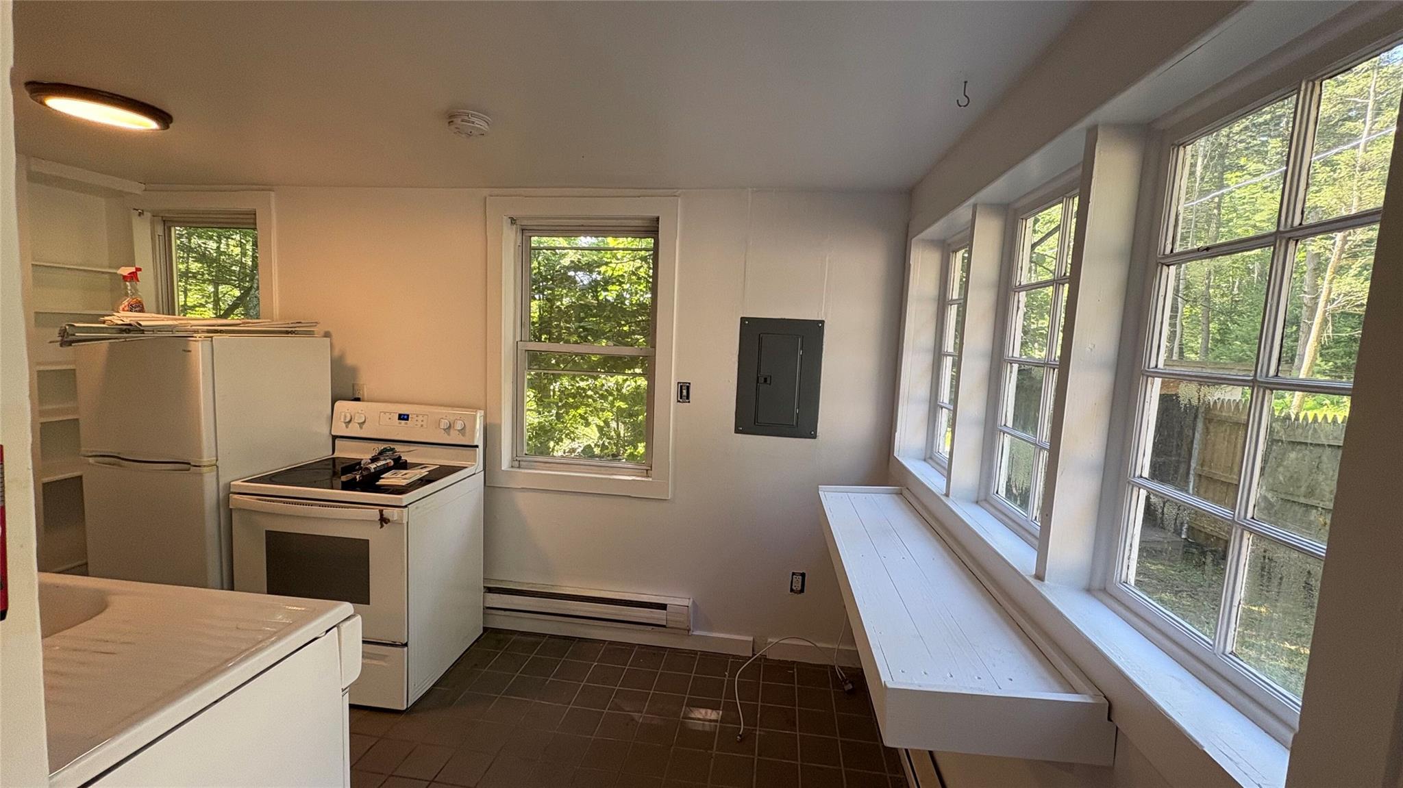 20 Airport Road Eldred, NY 12732 - Photo 15 of 23 a kitchen with a stove and a refrigerator