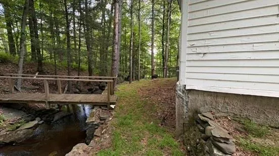 a balcony with table and chairs