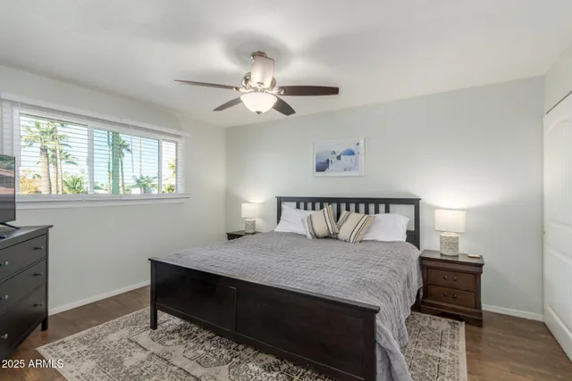 a bedroom with a bed and a table in it