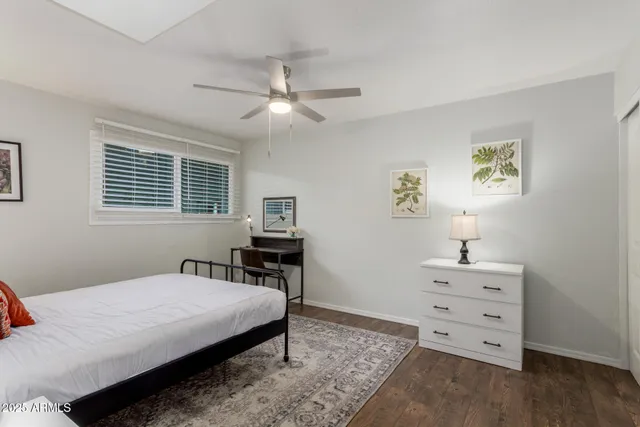 a bedroom with a bed and a dresser