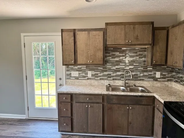 a bathroom with a bathtub and a toilet