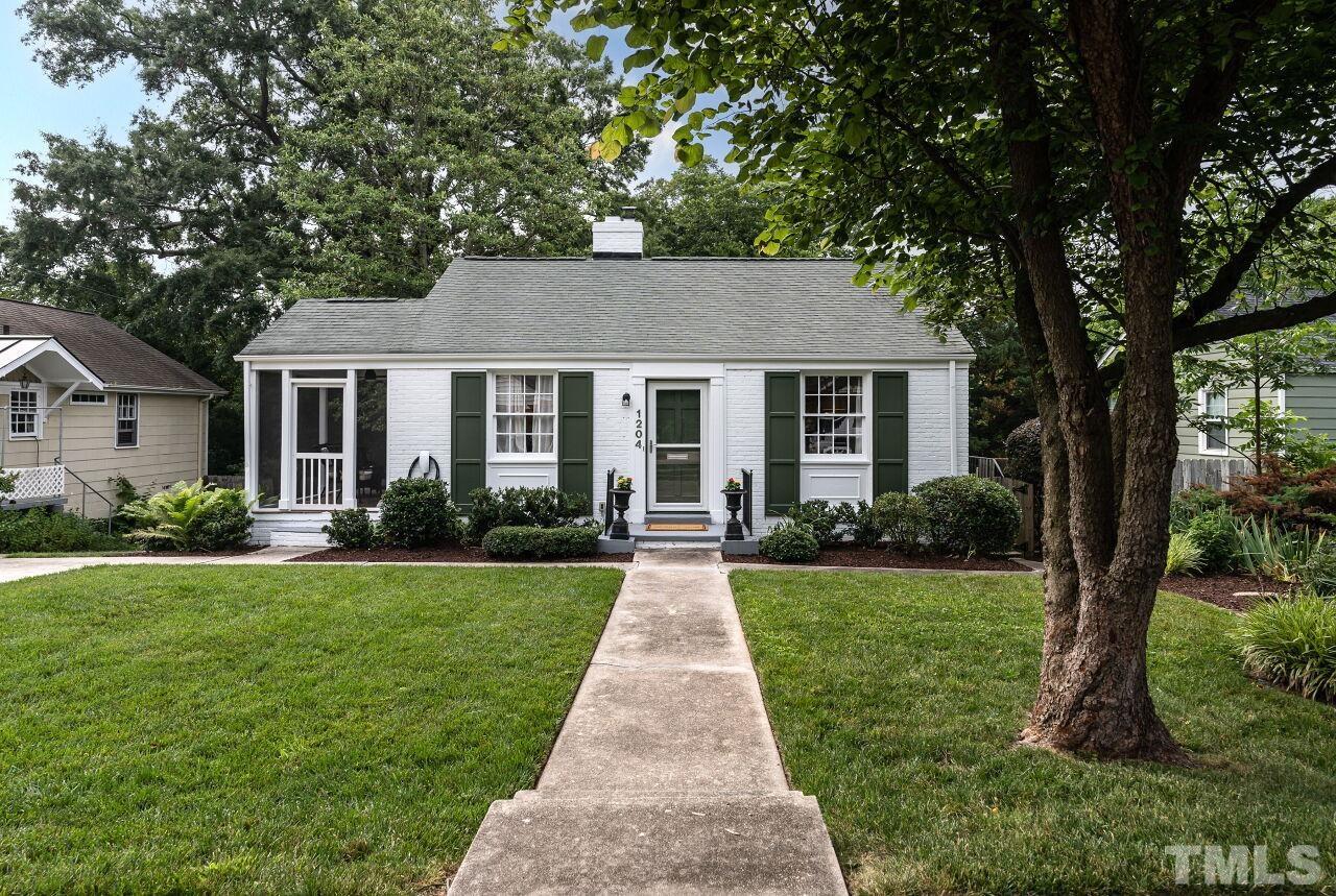 a front view of a house with yard