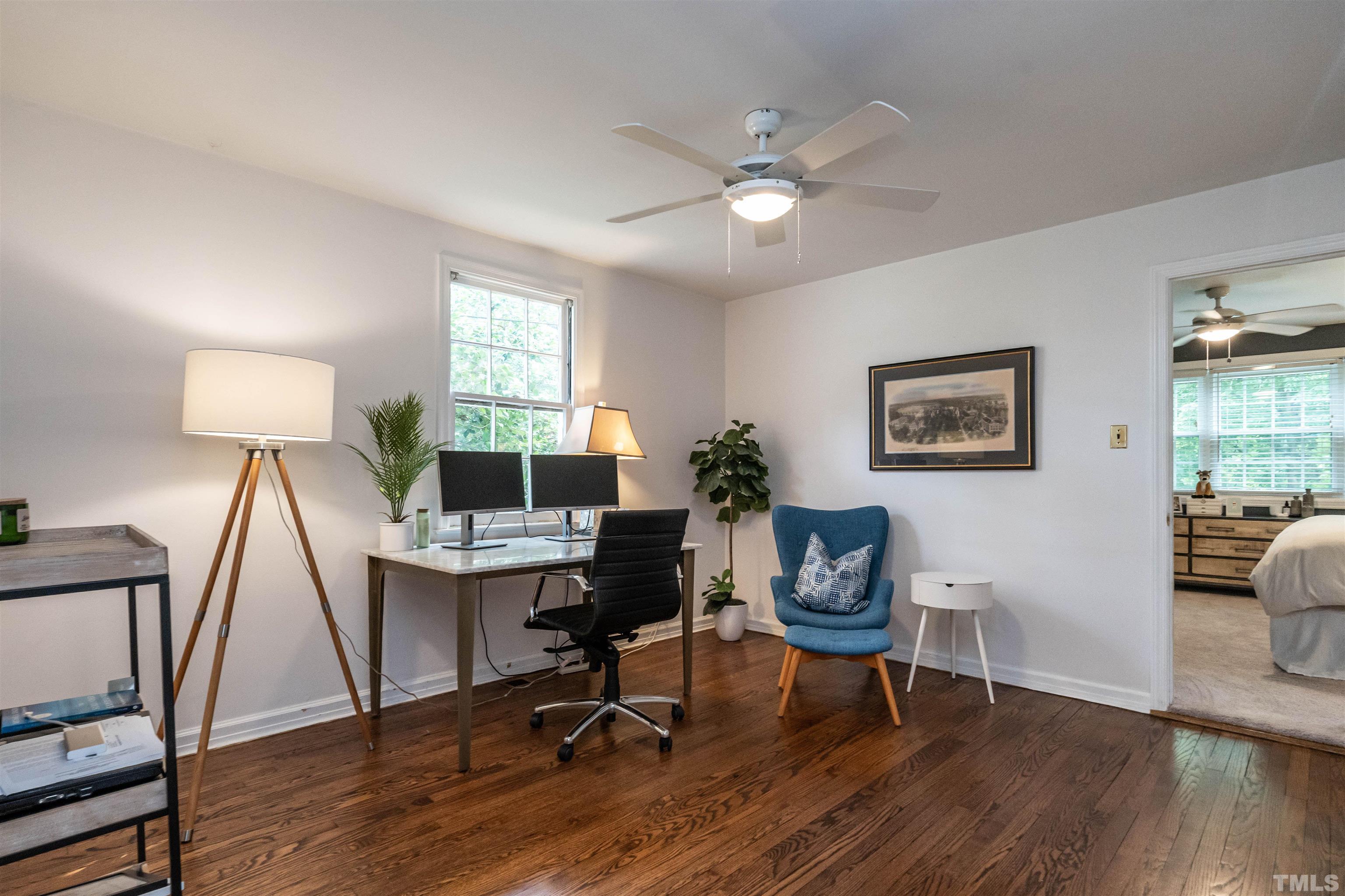 1204 Clifton Street Raleigh, NC 27604 - Photo 11 of 26 a view of a workspace with furniture and a window
