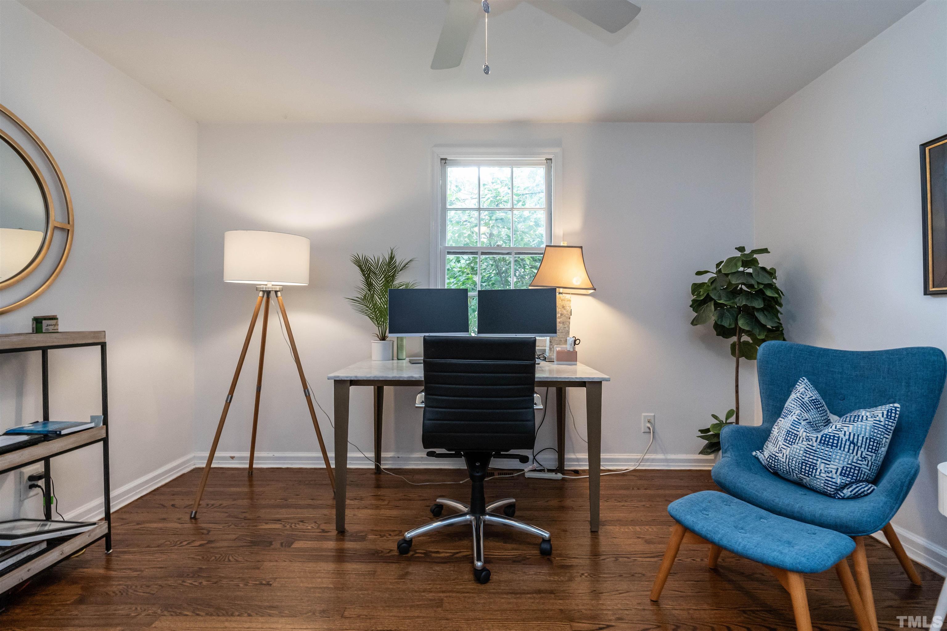 1204 Clifton Street Raleigh, NC 27604 - Photo 12 of 26 a living room with furniture a window and a potted plant