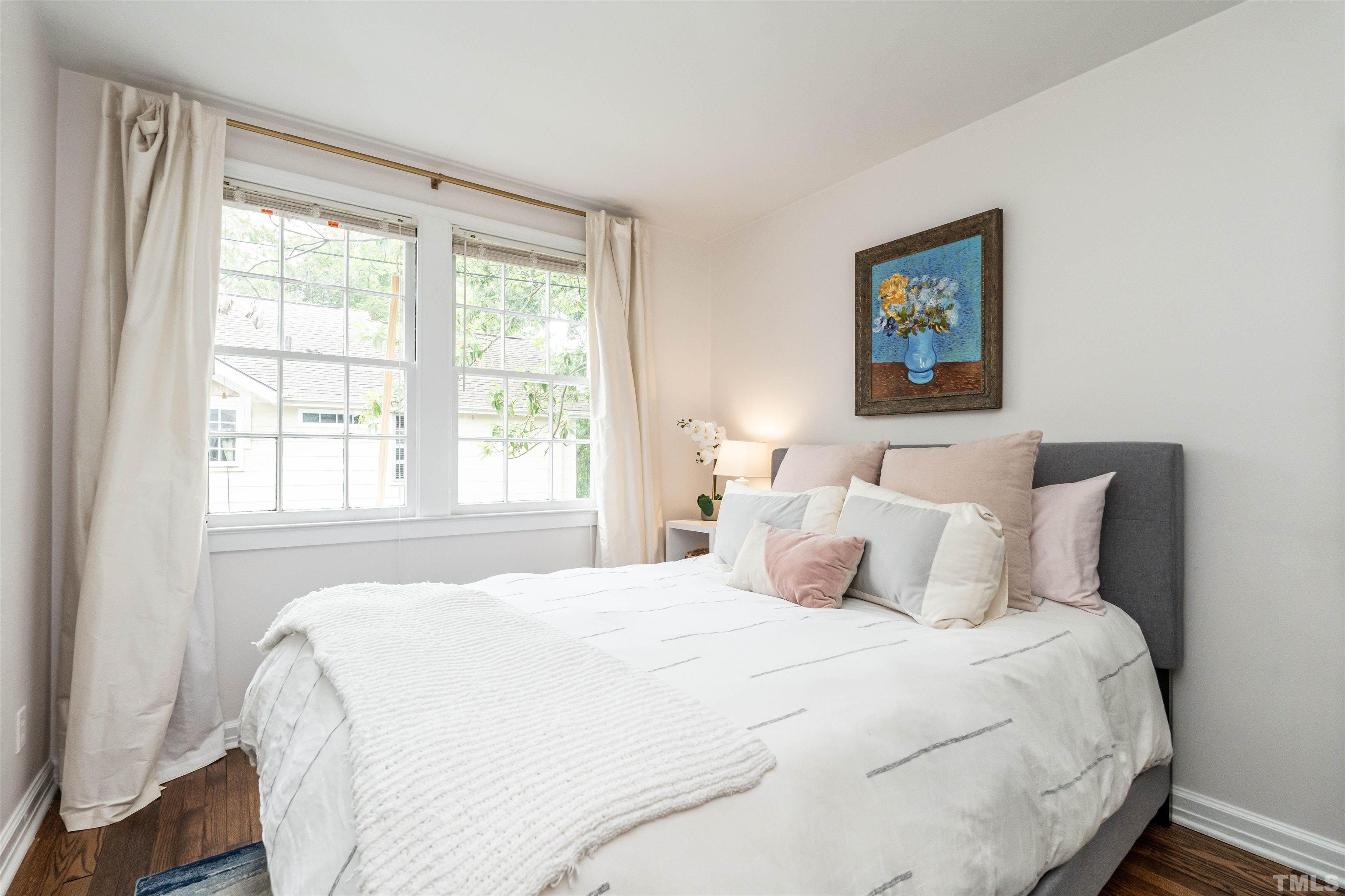 1204 Clifton Street Raleigh, NC 27604 - Photo 16 of 26 a bedroom with a bed and a window