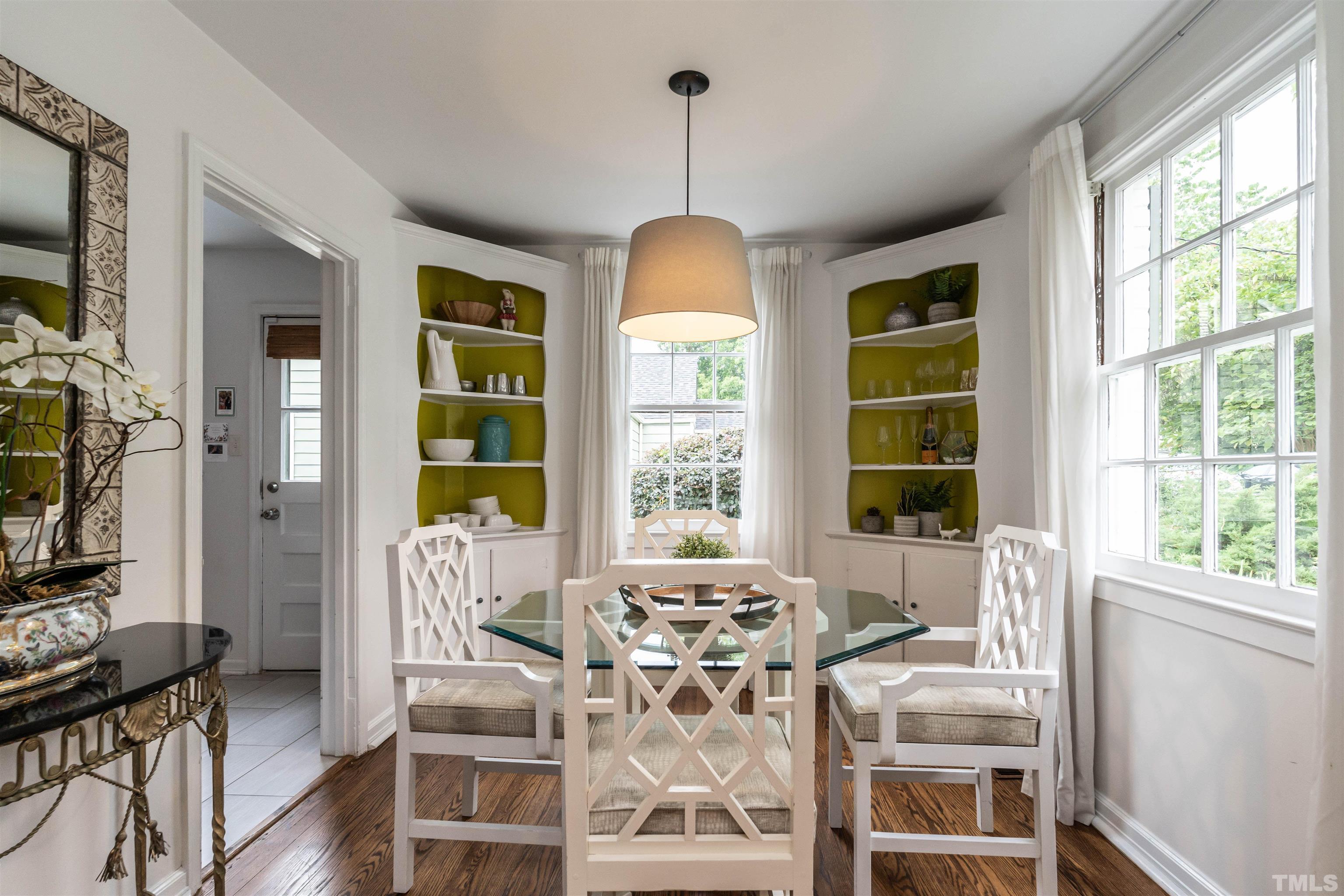1204 Clifton Street Raleigh, NC 27604 - Photo 7 of 26 a view of a dining room with furniture window and wooden floor