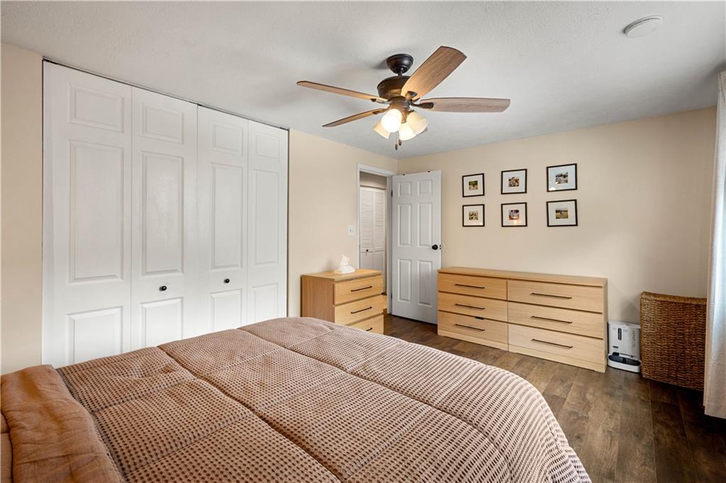137 Walnut Strand Imperial, PA 15126 - Photo 14 of 37 a bedroom with a large bed and a chandelier