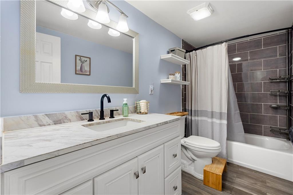 137 Walnut Strand Imperial, PA 15126 - Photo 15 of 37 a bathroom with a granite countertop sink toilet and shower