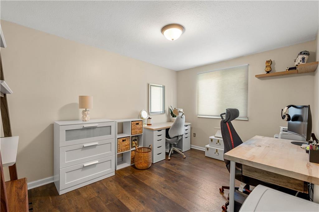 137 Walnut Strand Imperial, PA 15126 - Photo 17 of 37 a view of a workspace with furniture and wooden floor
