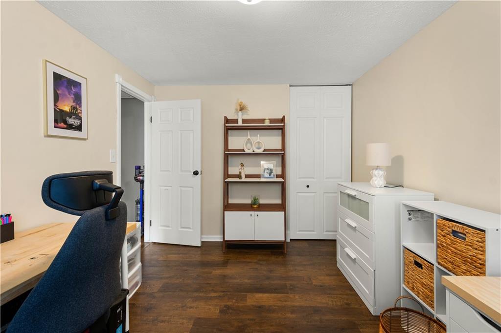 137 Walnut Strand Imperial, PA 15126 - Photo 18 of 37 a view of a workspace with furniture and wooden floor