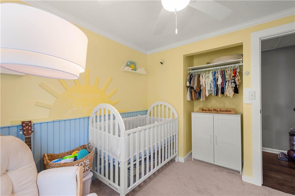 137 Walnut Strand Imperial, PA 15126 - Photo 20 of 37 a bedroom with a bed and wooden floor