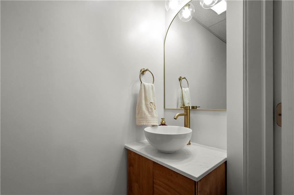 137 Walnut Strand Imperial, PA 15126 - Photo 23 of 37 a bathroom with a sink and a mirror