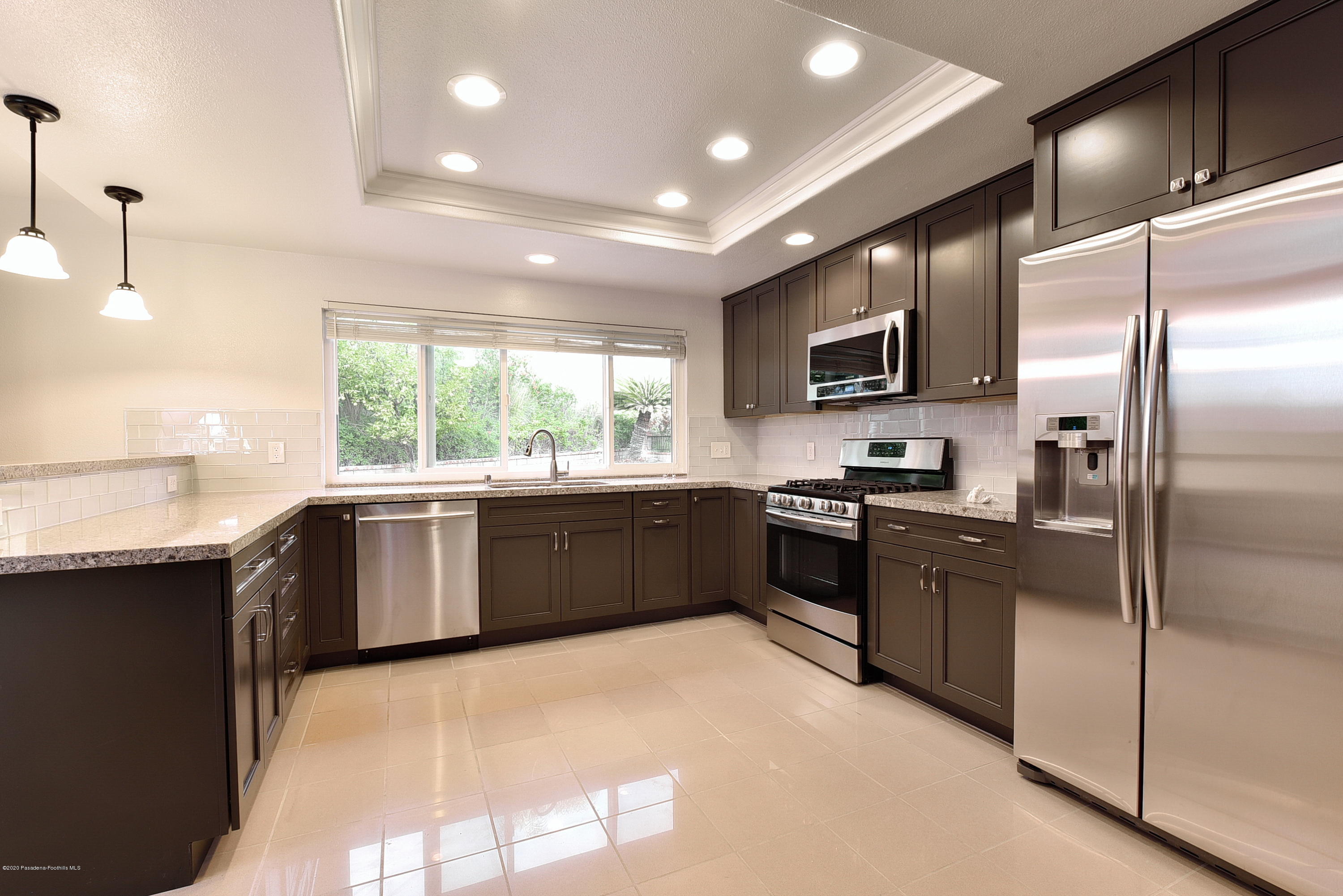 3107 Chadney Drive Glendale, CA 91206 - Photo 8 of 26 a large kitchen with a large window and stainless steel appliances