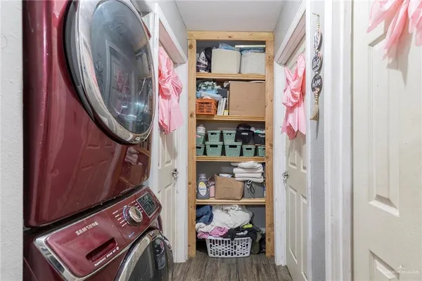 a view of an entryway with wooden floor