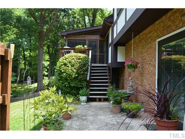 1701 Baker Road Raleigh, NC 27607 - Photo 17 of 25 a view of a house with a yard