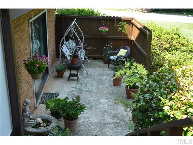 1701 Baker Road Raleigh, NC 27607 - Photo 18 of 25 a garden view with a seating space