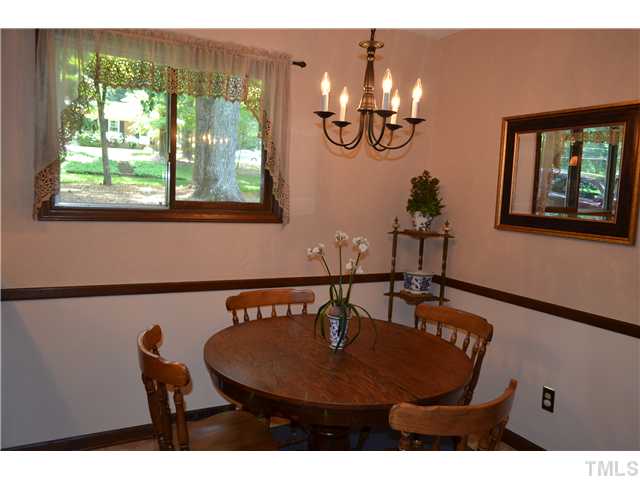 1701 Baker Road Raleigh, NC 27607 - Photo 4 of 25 a view of a dining room with furniture window and outside view