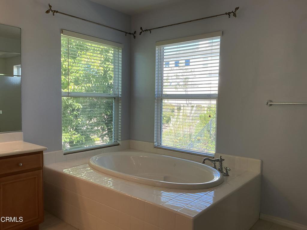 13687 Blue Ridge Way Moorpark, CA 93021 - Photo 19 of 46 a bath tub sitting in a bathroom next to a window