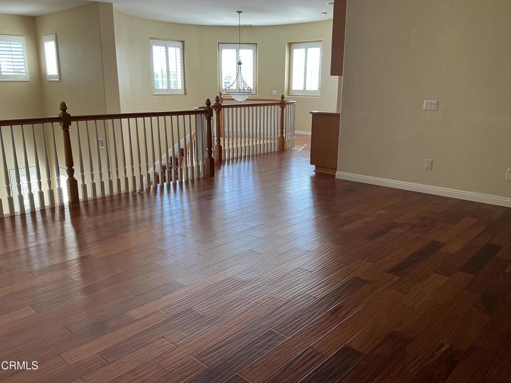 13687 Blue Ridge Way Moorpark, CA 93021 - Photo 20 of 46 wooden floor in an empty room with a window
