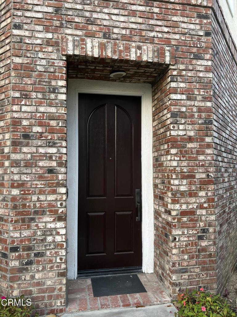 13687 Blue Ridge Way Moorpark, CA 93021 - Photo 3 of 46 a front view of a building with a door