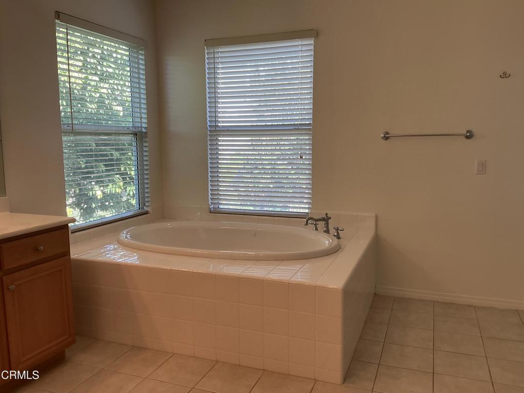 13687 Blue Ridge Way Moorpark, CA 93021 - Photo 31 of 46 a bath tub sitting in a bathroom next to a window
