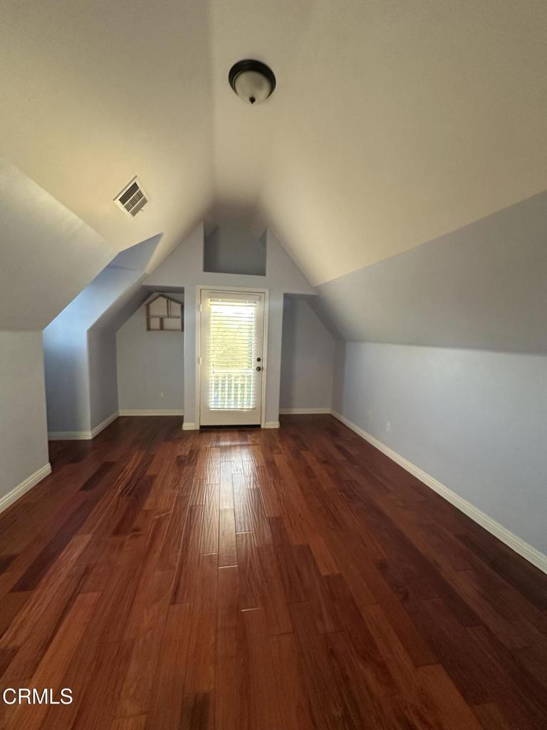 13687 Blue Ridge Way Moorpark, CA 93021 - Photo 6 of 46 an empty room with wooden floor and windows