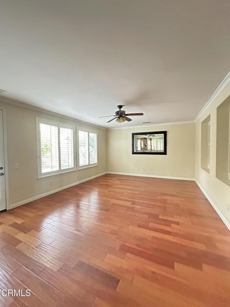13687 Blue Ridge Way Moorpark, CA 93021 - Photo 7 of 46 a view of an empty room with wooden floor and a window