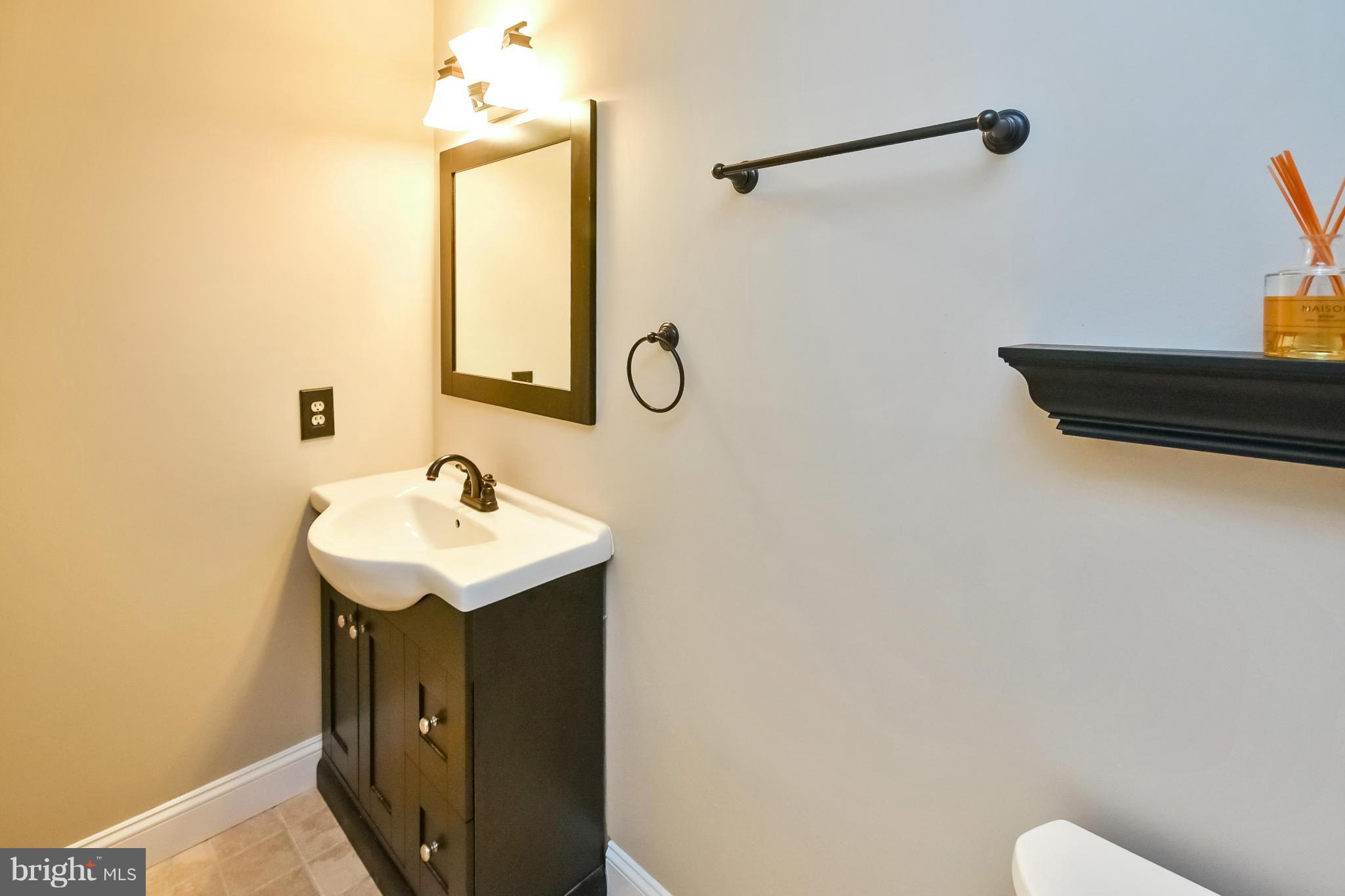 5167 Red Cedar Road Sumerduck, VA 22742 - Photo 14 of 30 a bathroom with a sink and a mirror