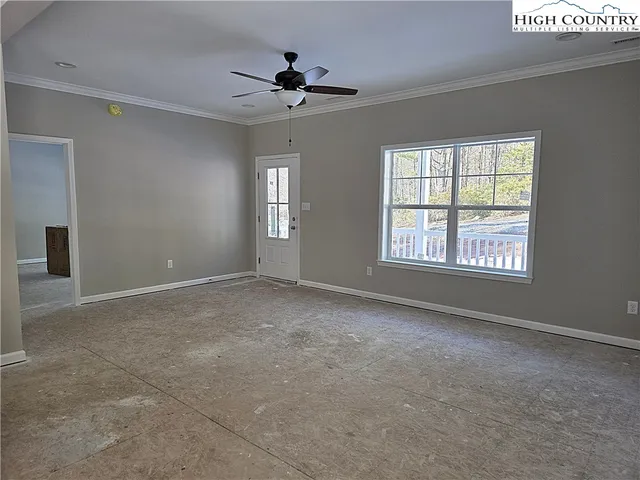 a view of an empty room with a window