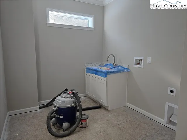 a view of storage and utility room with two washing machine