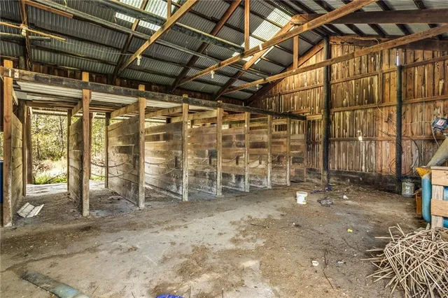 a view of empty room with wooden walls