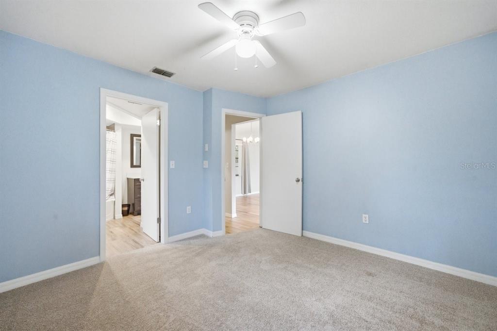 8316 Kingsdale Street Spring Hill, FL 34608 - Photo 16 of 30 an empty room with fan and entrance