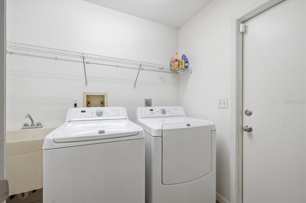 8316 Kingsdale Street Spring Hill, FL 34608 - Photo 20 of 30 a utility room with dryer and washer