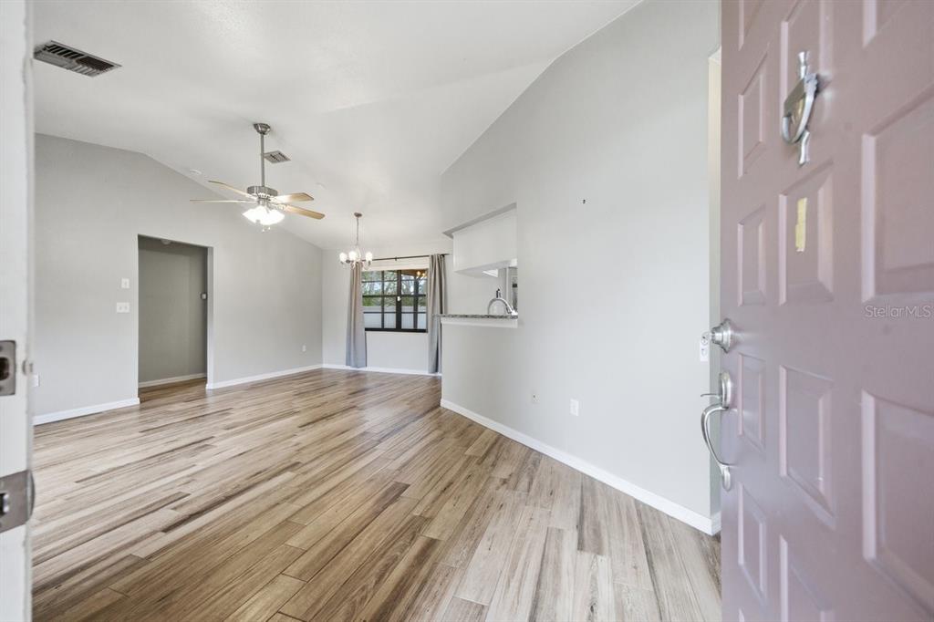 8316 Kingsdale Street Spring Hill, FL 34608 - Photo 2 of 30 a view of empty room with wooden floor