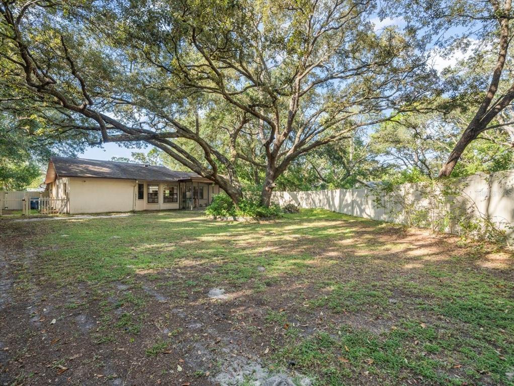 8316 Kingsdale Street Spring Hill, FL 34608 - Photo 21 of 30 a view of a house with a yard