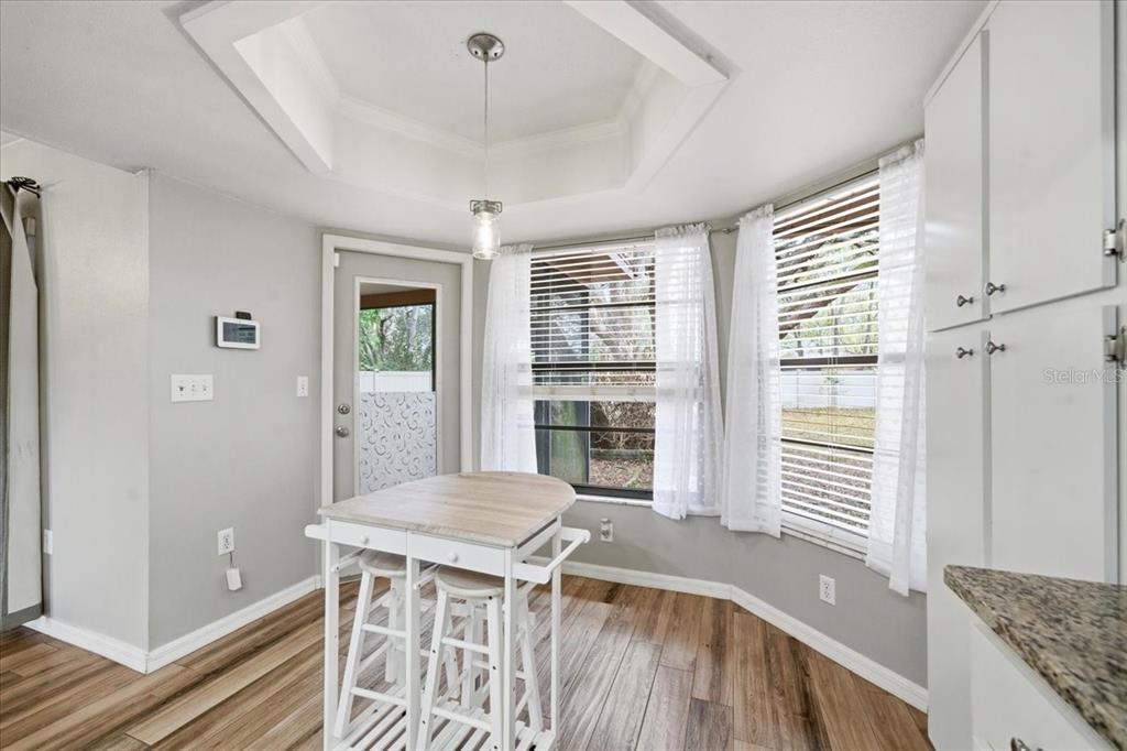 8316 Kingsdale Street Spring Hill, FL 34608 - Photo 10 of 30 a view of a livingroom with furniture window and wooden floor
